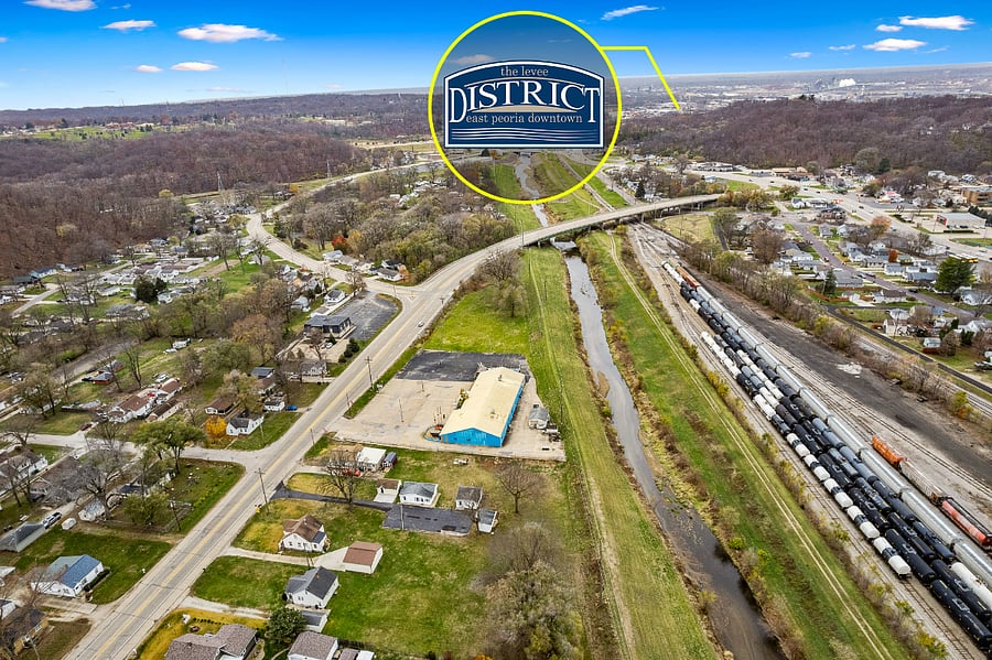 Arial view of property and proximity to hospitals and Levee district shopping area,