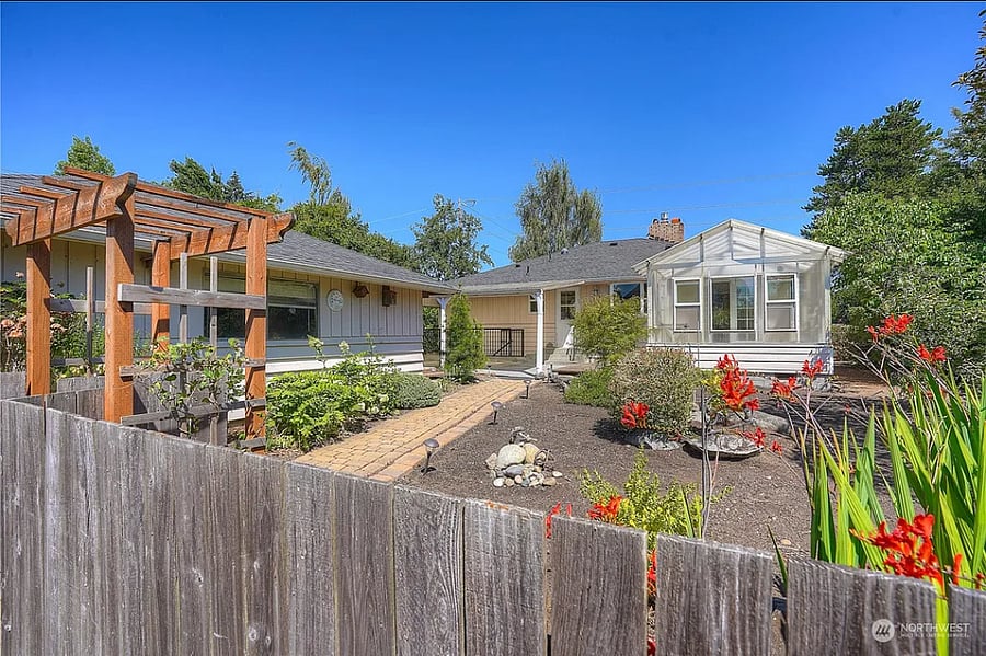Back garden with covered patio, sunroom, and 2 car garage.
Basement access from stairs, but basement remains locked to renters unless otherwise negotiated.