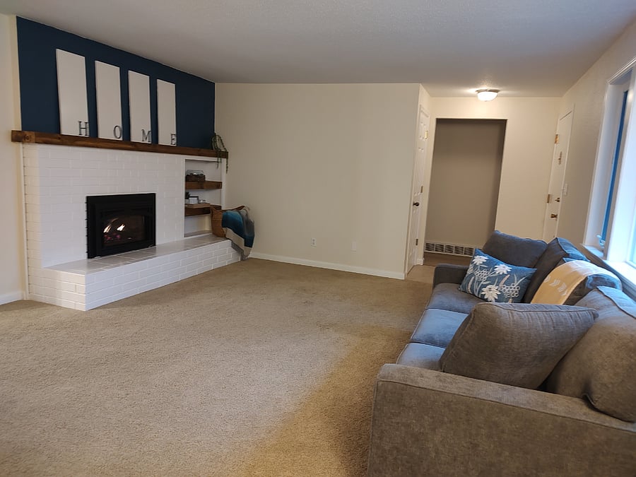 Spacious living room with cozy fireplace