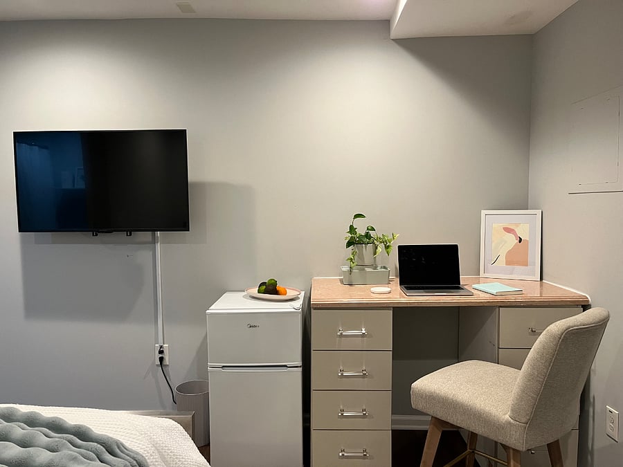 Smart TV, mini fridge and desk with storage