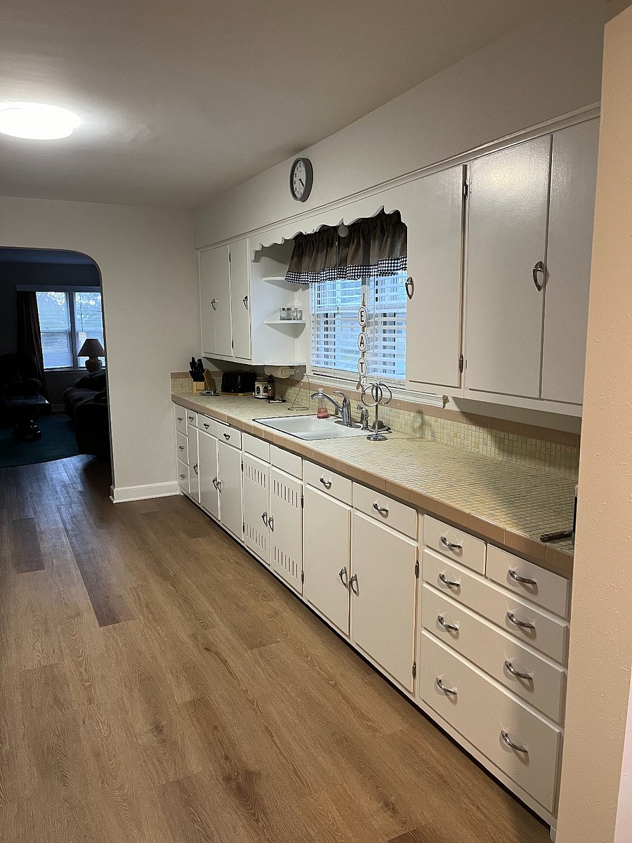 Ample kitchen cabinets for storage.