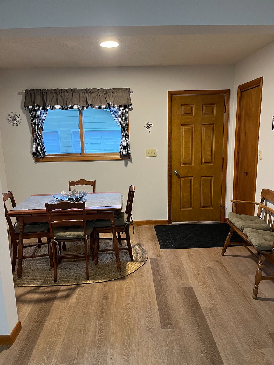 Back entrance with closet and dining nook.