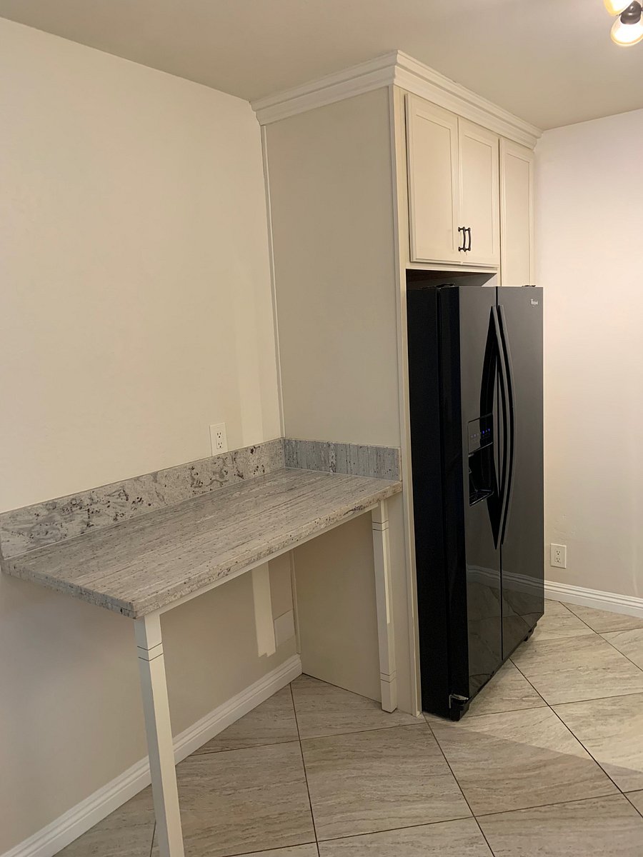 Kitchen - facing the other granite counter top and full size refrigerator