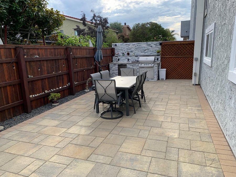 Shared backyard with BBQ, mini-refrigerator, stove, burner and sink.