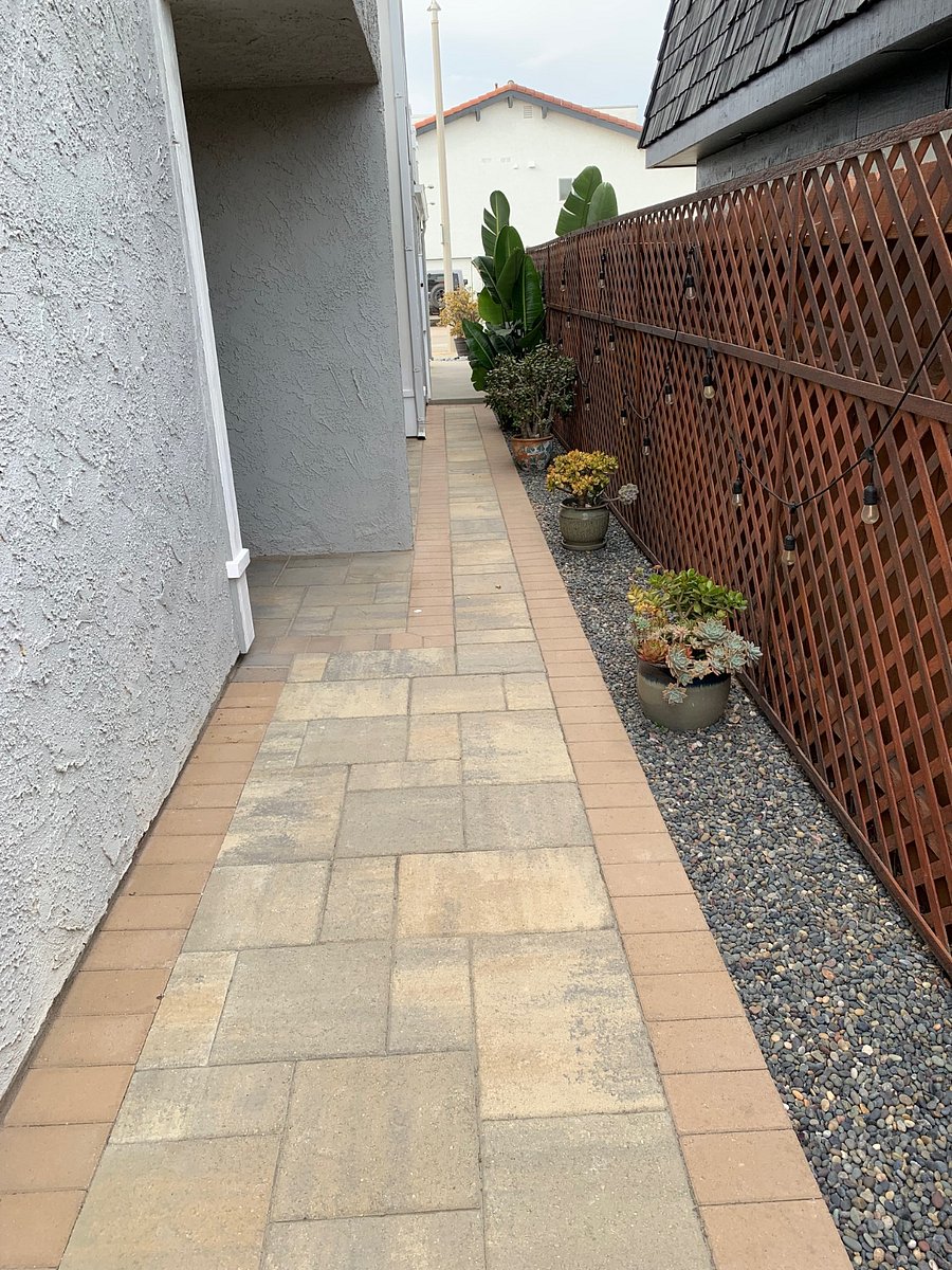 Paver walkway connecting designated patio to the shared backyard.