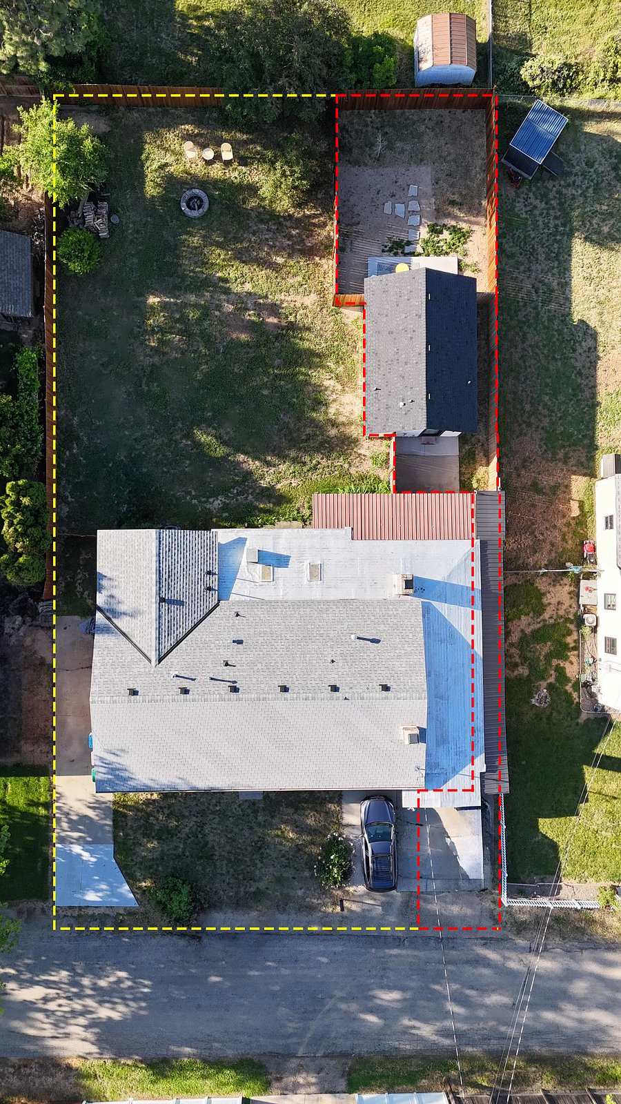 An aerial photo that shows the main house in relation to the short term rental unit in the back.