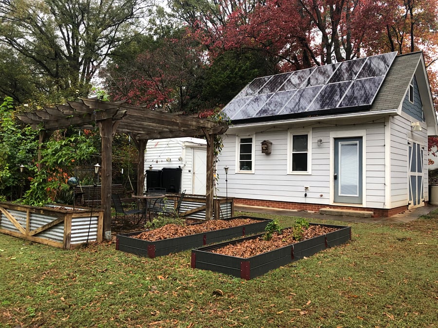 Raised bed gardens and a relaxing swing under pergola make for good times outdoors.  Workshop is private to owners and not available to tenants.