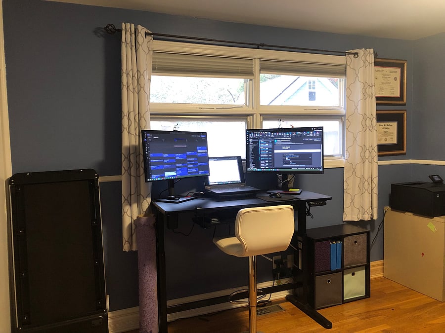 3rd bedroom or office area with adjustable standing/sitting desk, exercise equipment, and bookcase. Optional single bed could be included.