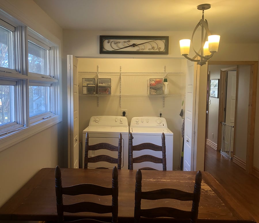 Laundry area next to dining table