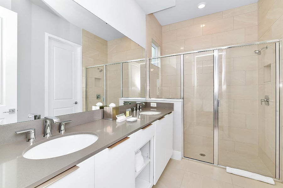 Dual-sinks and toilet attached to master bedroom
