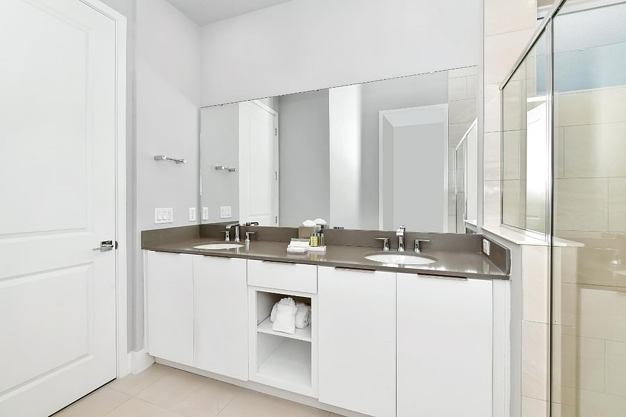 Dual-sinks and toilet attached to master bedroom
