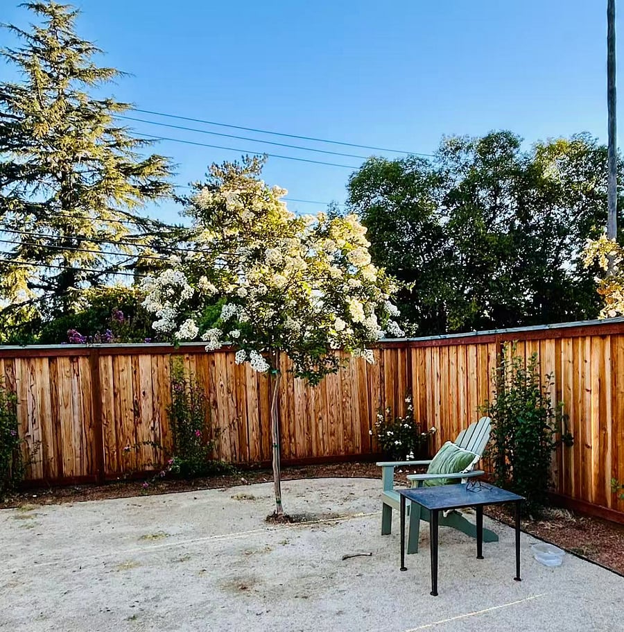 walled patio and garden, gas grill provided, with nice eating area. two planter boxes included. 