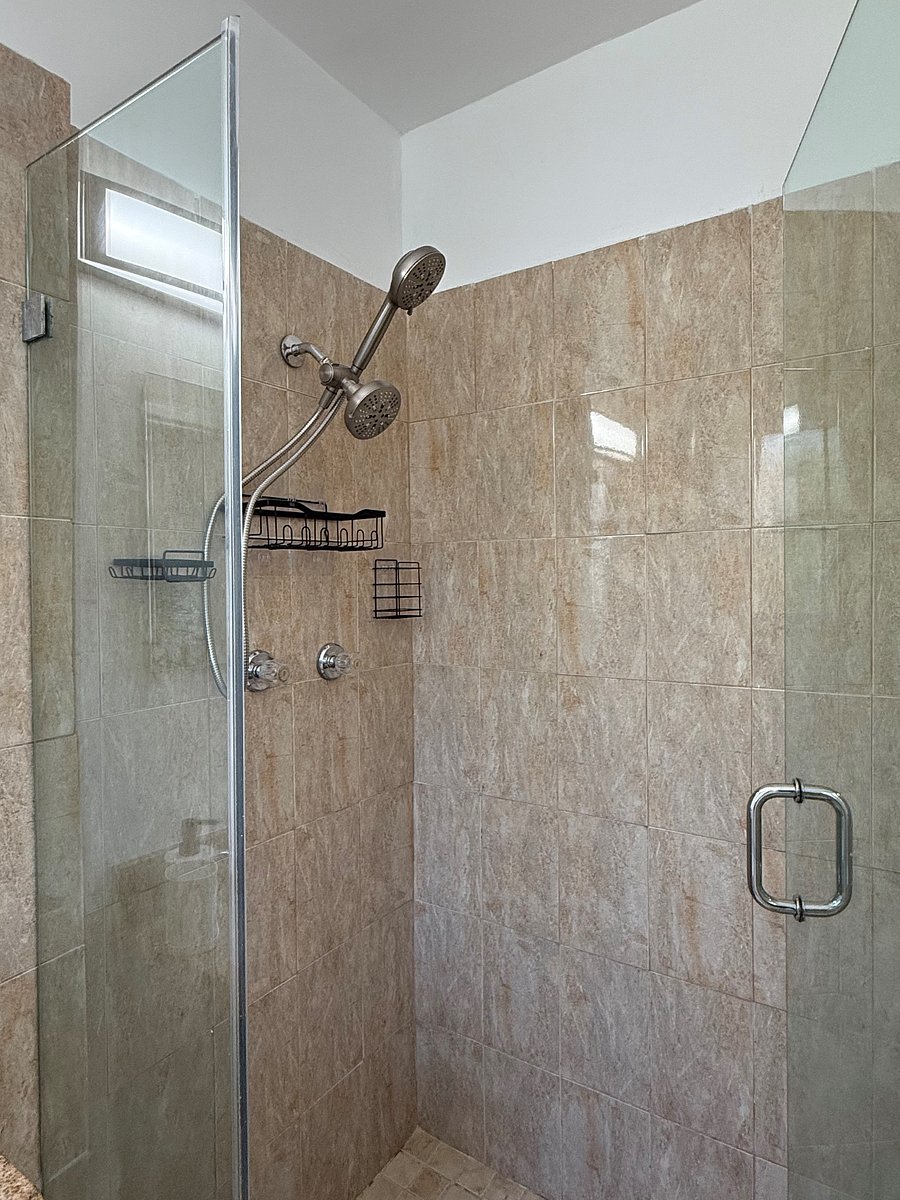 Glass Enclosed Shower with Ceramic Tiles