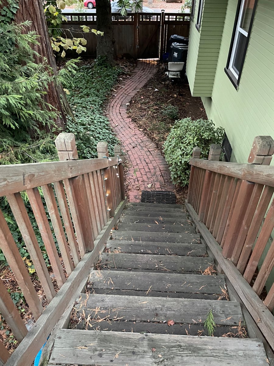 Private entrance through side gate, up the stairs, and in the back of the house.