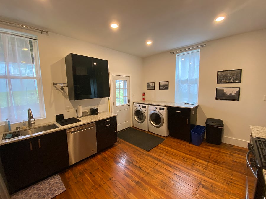 Large open kitchen with gas range, microwave, fridge/freezer, pot filler. Plenty of space to cook, bake, and make a nice pot of coffee or cup'o'tea! Also, laundry at your fingertips!
