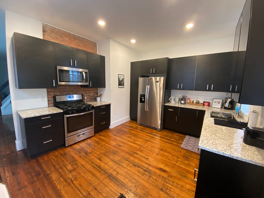 Large open kitchen with gas range, microwave, fridge/freezer, pot filler. Plenty of space to cook, bake, and make a nice pot of coffee or cup'o'tea! Also, laundry at your fingertips!