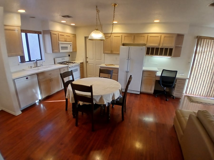 Full kitchen (table has a leaf to seat six) with built-in desk space.