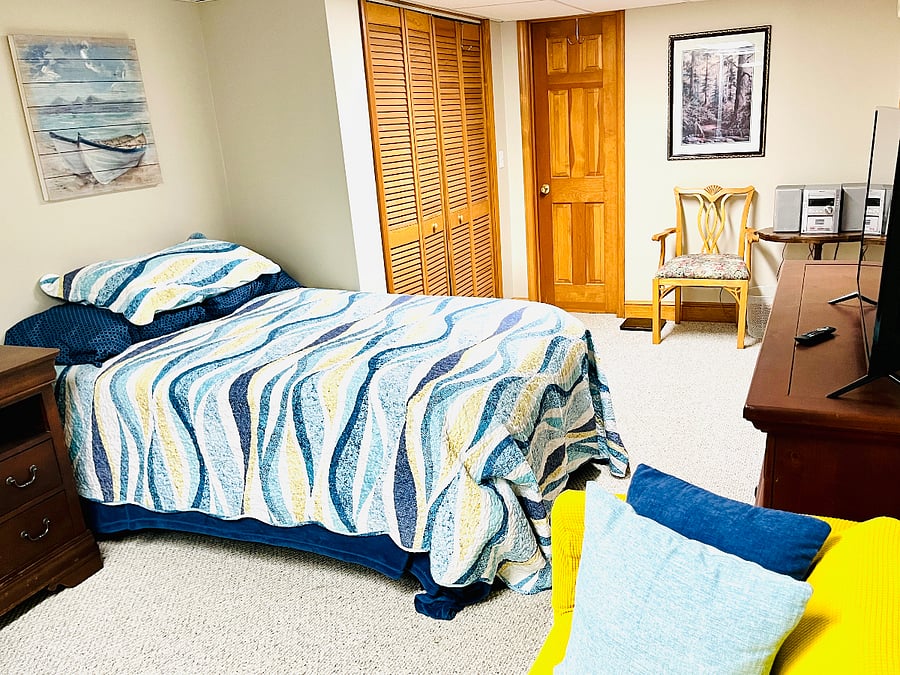 door to bathroom, large closets, and more sitting area.