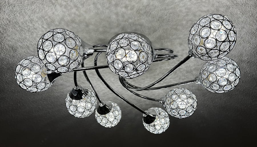 The 9 lights of the dining room chandelier can be individually or collectively voice controlled, adjusted to many different colors, and synchronized to music in the room. 