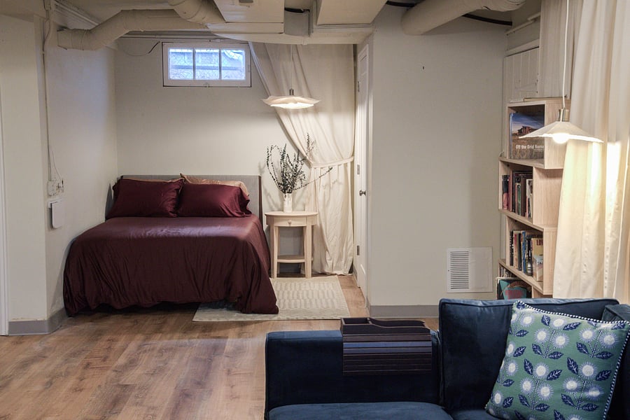 Basement bedroom nook as seen from basement TV den