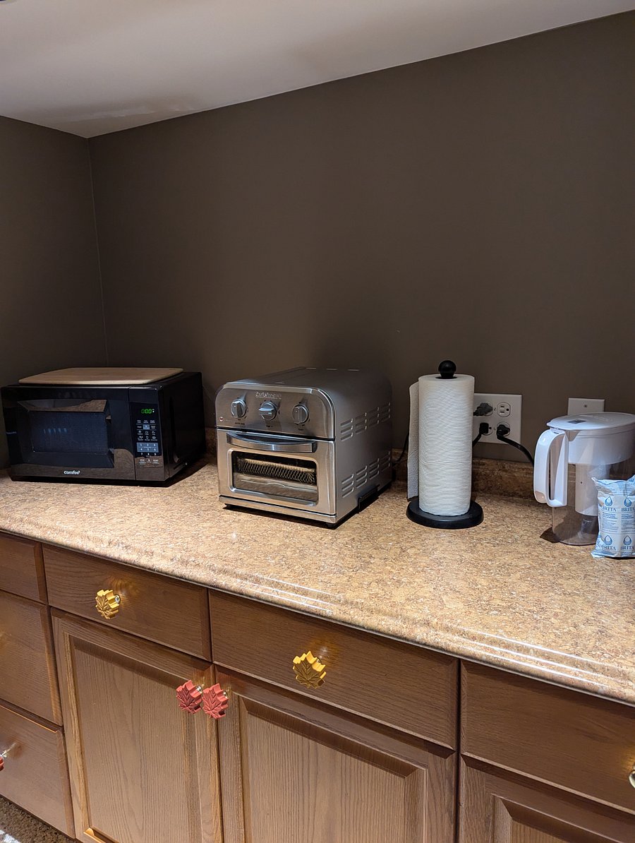 Microwave, air fryer, Keurig and mini fridge.
