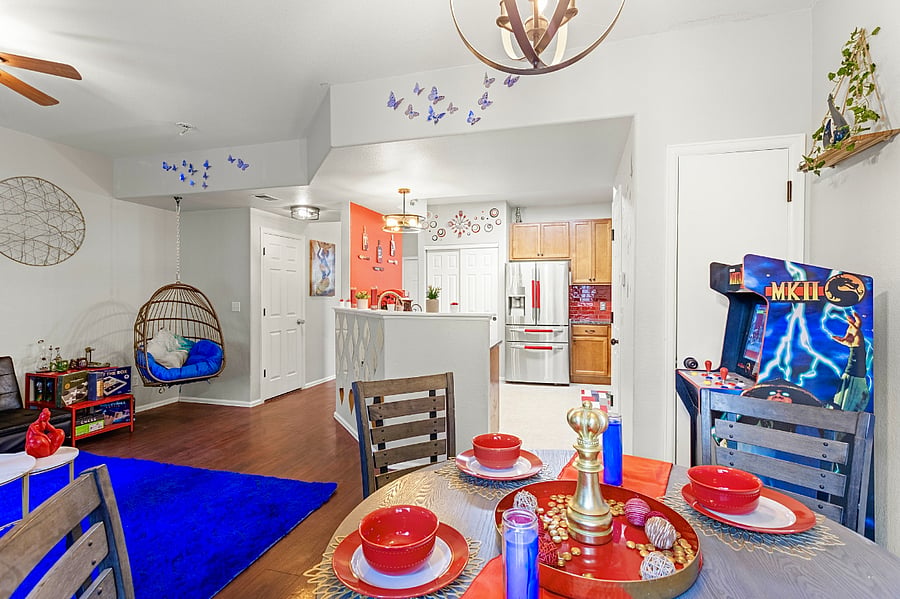 Spacious and open-concept living area with a cozy sitting nook and a fully equipped kitchen. Perfect for entertaining guests or enjoying a quiet night in.
