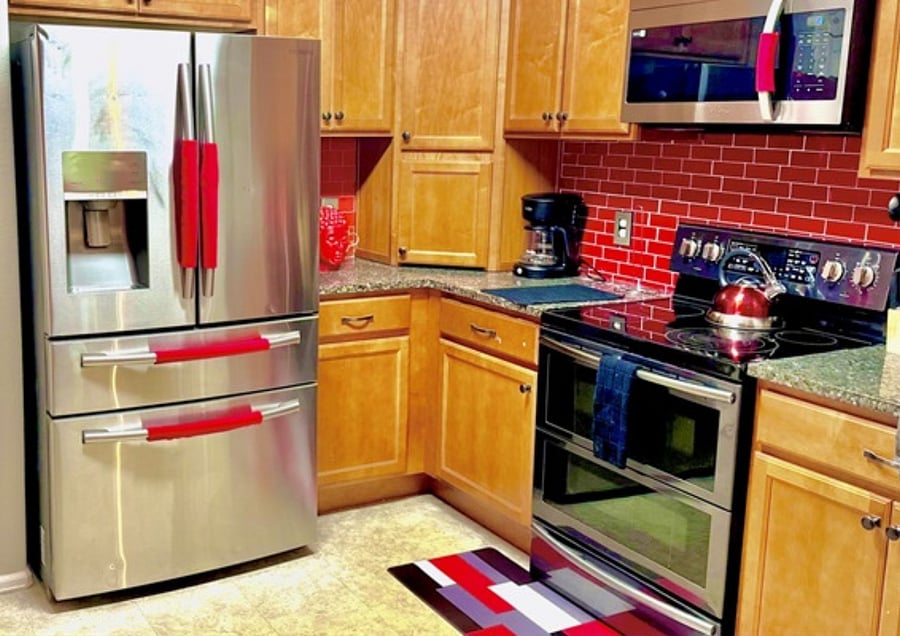 A modern and fully equipped kitchen featuring stainless steel appliances, ideal for preparing delicious meals.
