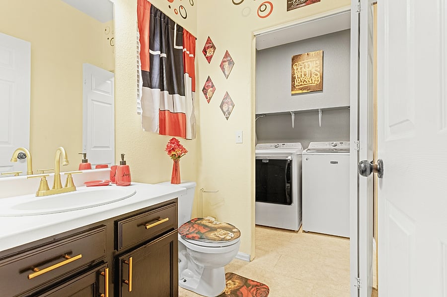 Bright and airy bathroom with a convenient in-unit washer and dryer. Perfect for freshening up after a day of exploring.