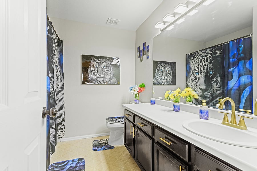 Bright and airy bathroom with a double vanity and a touch of animal print. Perfect for getting ready in the morning.