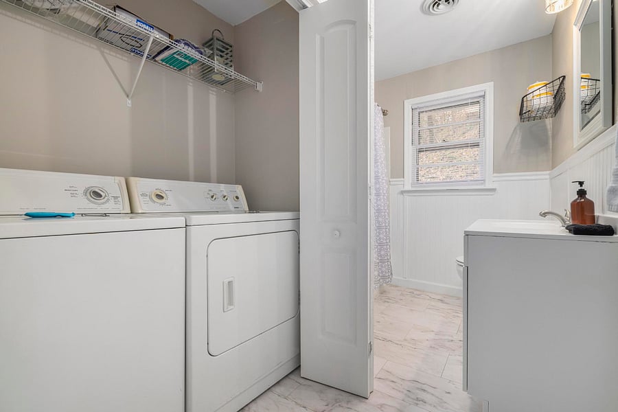 The second bathroom has a washer and dryer.