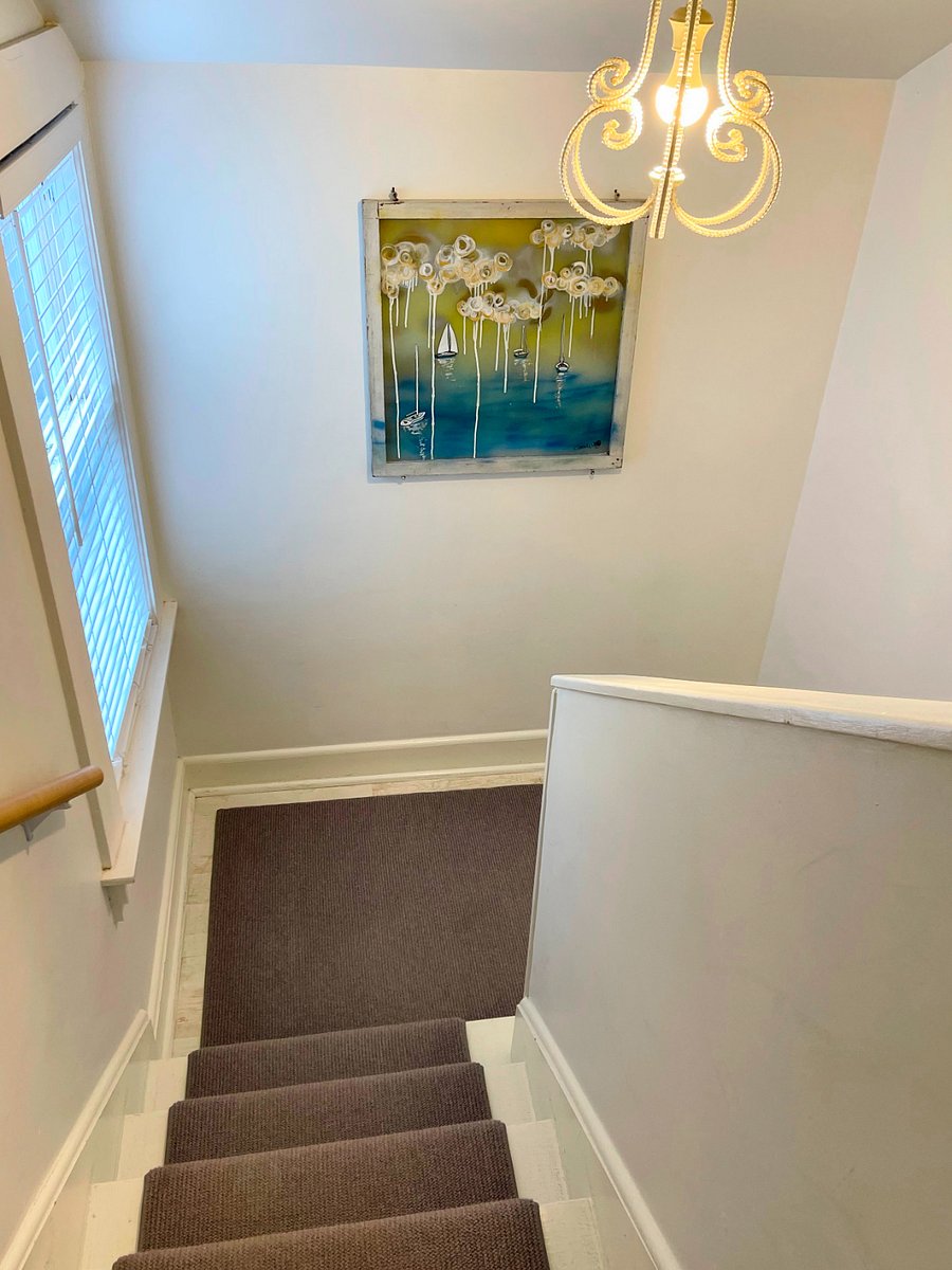 Stairway up to loft bedroom with king bed