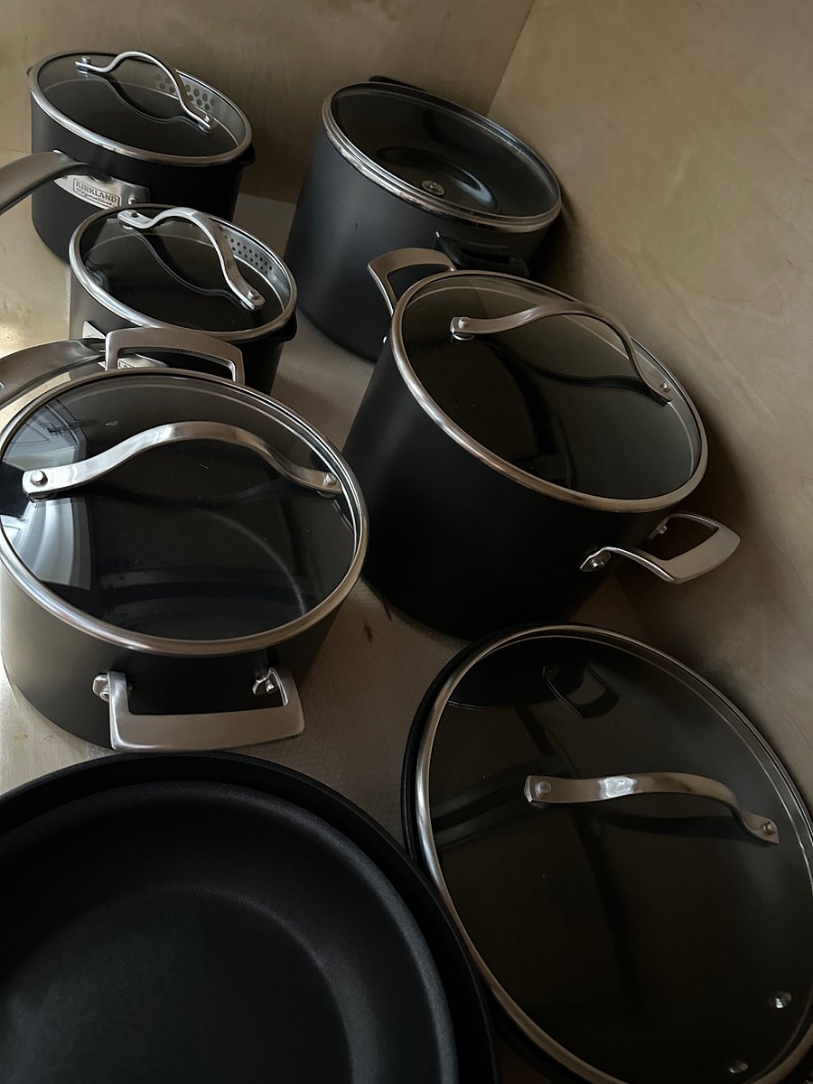 Stocked with a full set of pots and pans as well as bowls, cookie sheets, etc.
