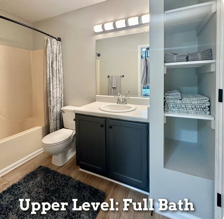 Full bath with tub/shower combination. 