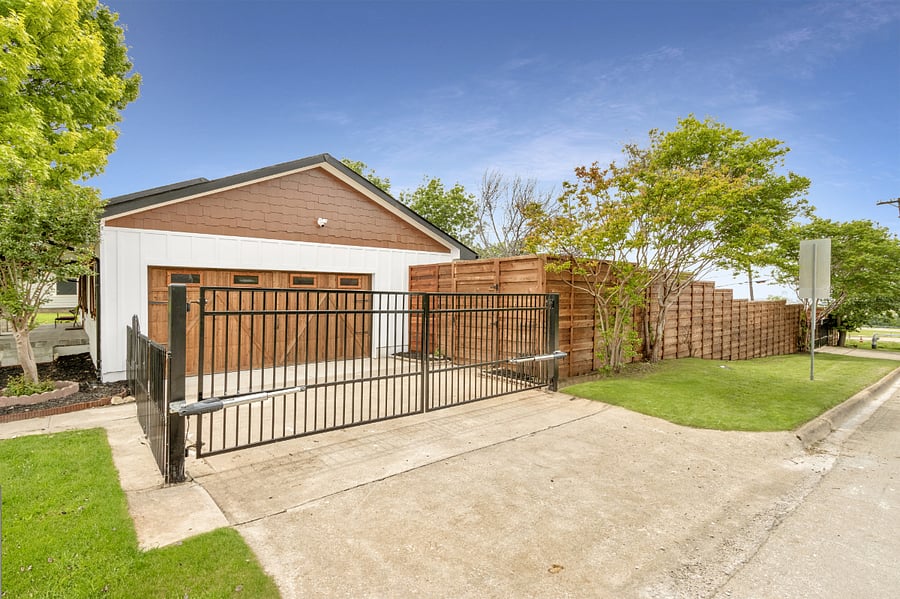 Gated driveway entry to garage with remote.