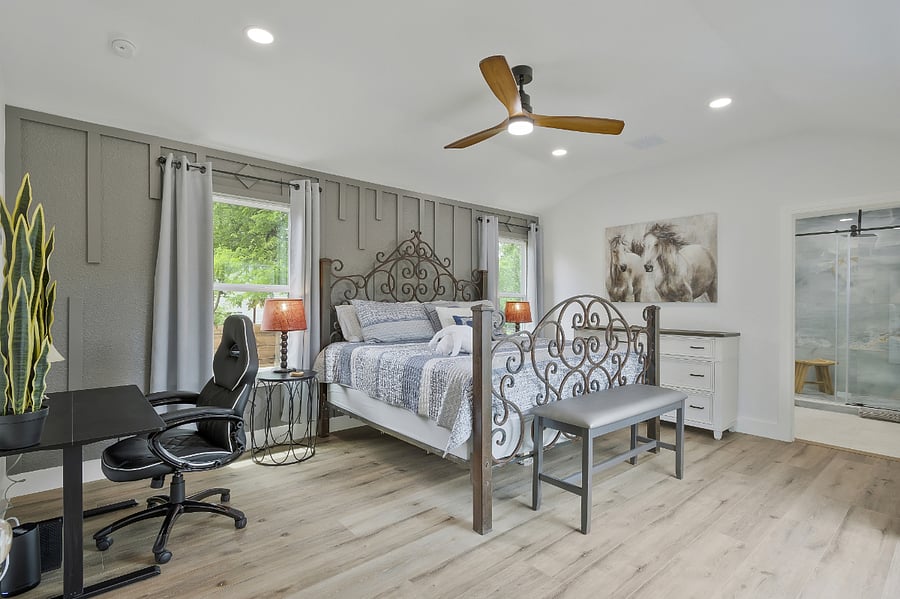 Master bedroom showing attached master bath and large adjustable height desk and chair