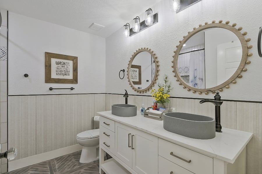 2nd guest bathroom with full tub and shower, double vanities