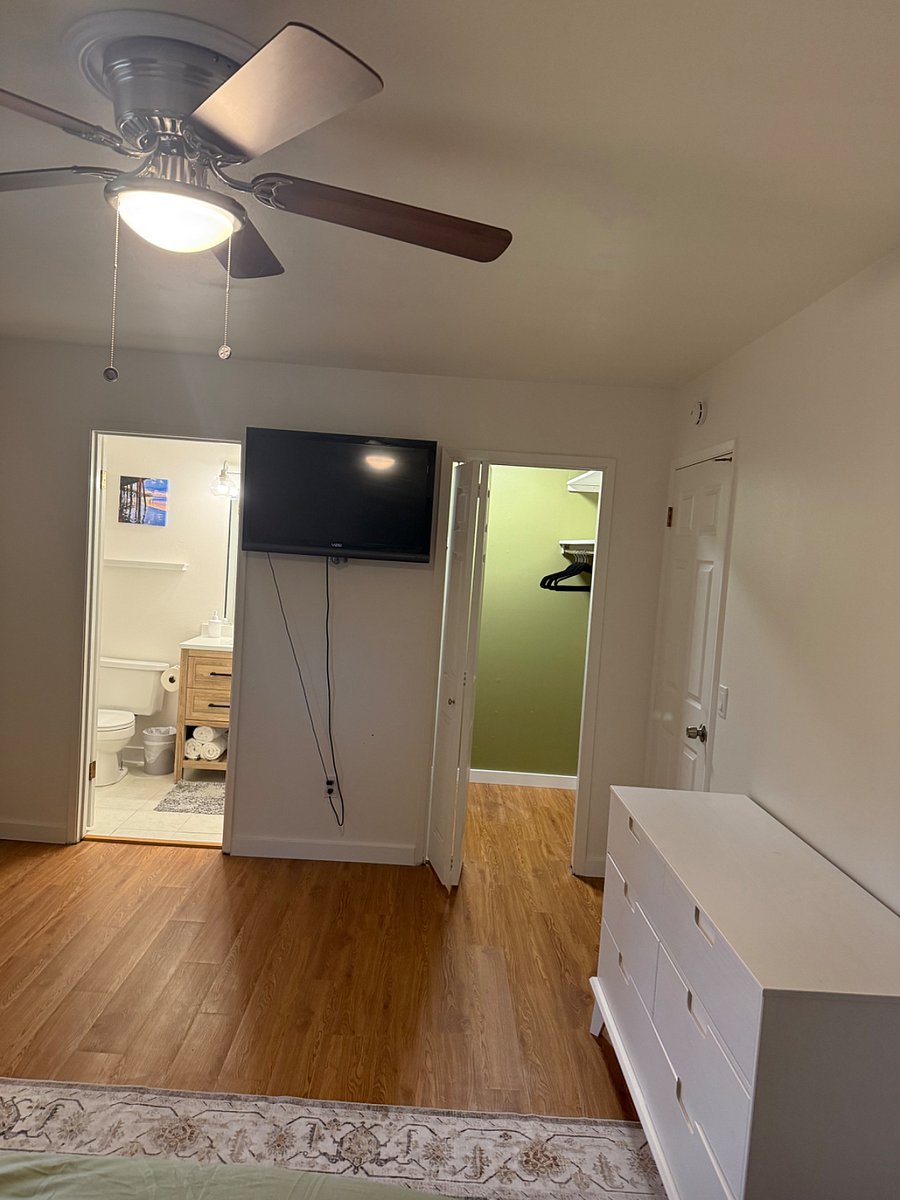 Master bedroom has walk-in closet, smart tv and private bathroom.