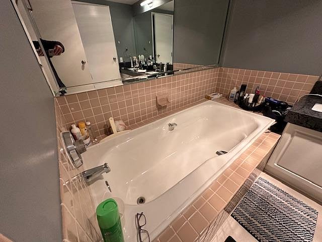 Shared tub in private area of unit