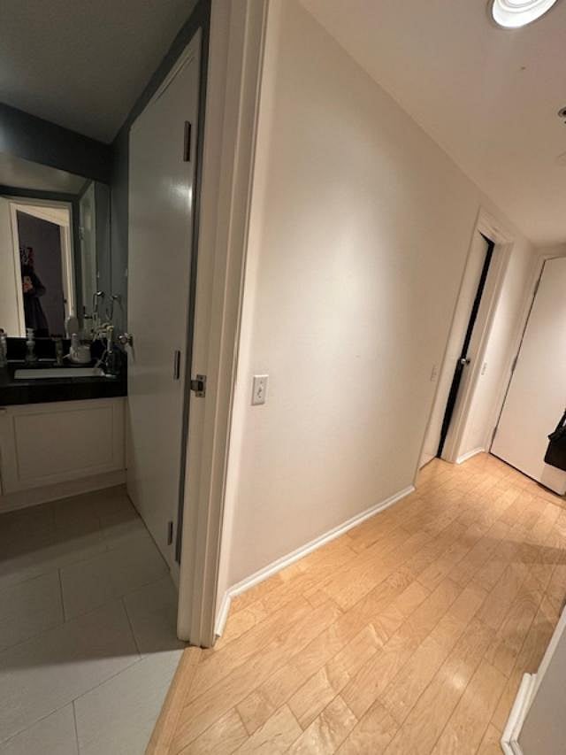 Hallway with master down the hall on right and bathroom with shower on the left