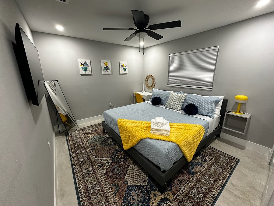 King bed, Smart TV, closet space, blackout shades, desk area w/ lamp.