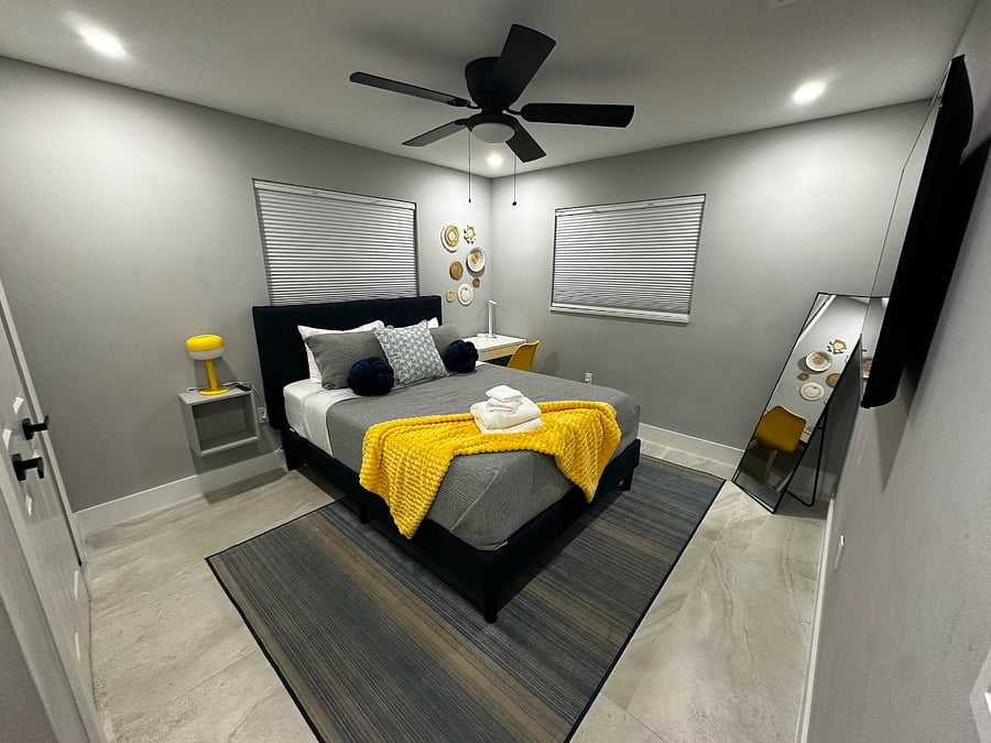 Queen bed, Smart TV, closet space, blackout shades, desk area w/ lamp.