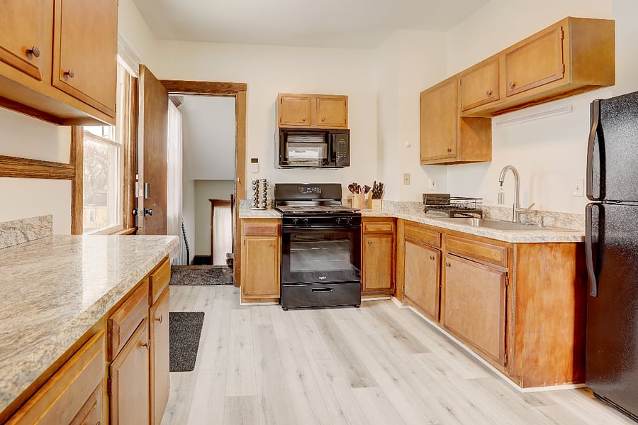Kitchen looking into backdoor hallway.