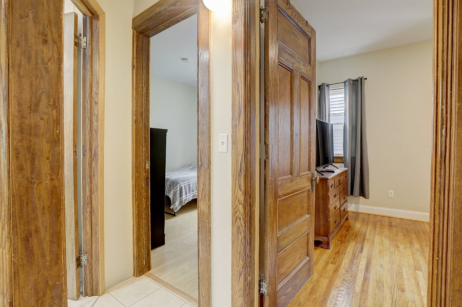 Hallway to bathroom and two bedrooms.