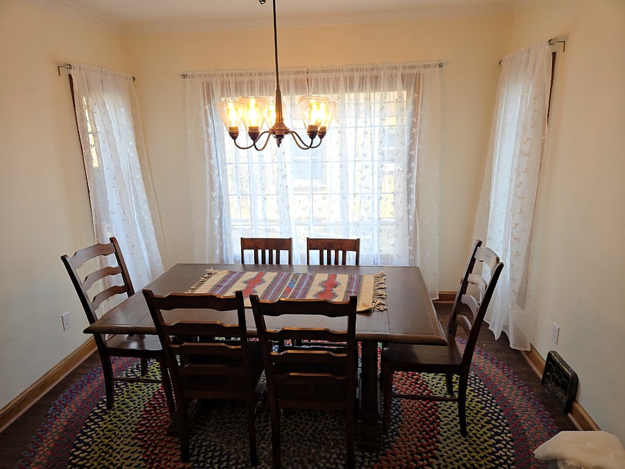 Cheerful, light filled dining room for larger gatherings or to spread out work/study materials.