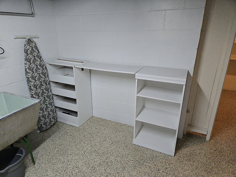 Nice space near the dryer for folding clothes. Full size ironing board and iron provided.