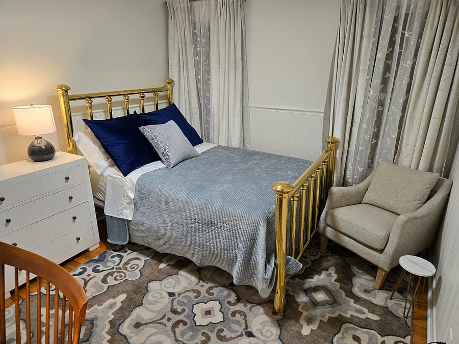 Fantastic antique brass bed keeps decor true to the historical style of the home while high quality mattress and linens keep you comfortable in today's standard.