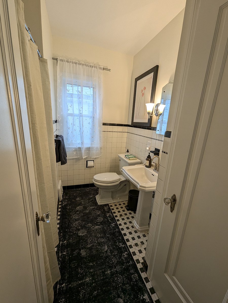 Charming historical bathroom with tons of storage.