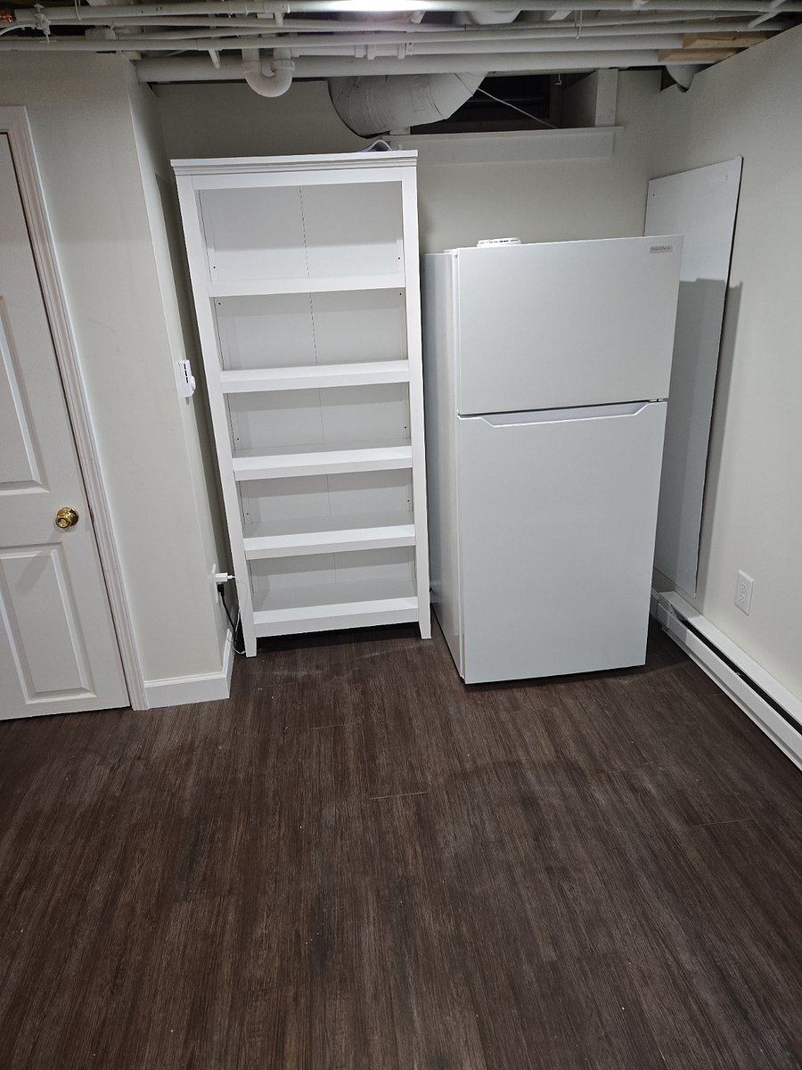 There is an extra refrigerator and storage shelves in the basement in case the space in the kitchen isn't quite enough. We've even labeled the spaces for each room to mitigate any issues.