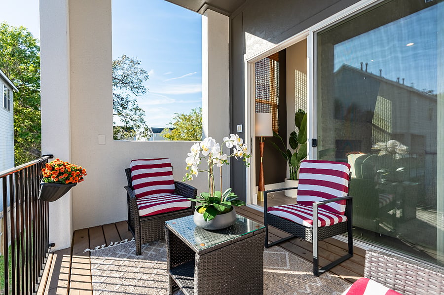 Enjoy a relaxing time on the balcony right outside of the living room/kitchebn