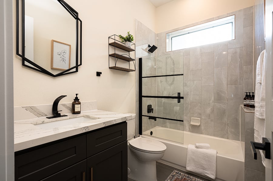 A modern full bathroom featuring a sleek design on the first floor